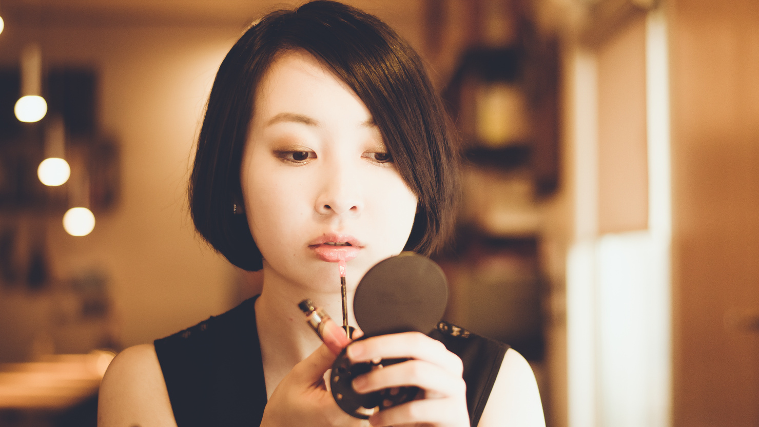 Japanese Woman Putting on Makeup