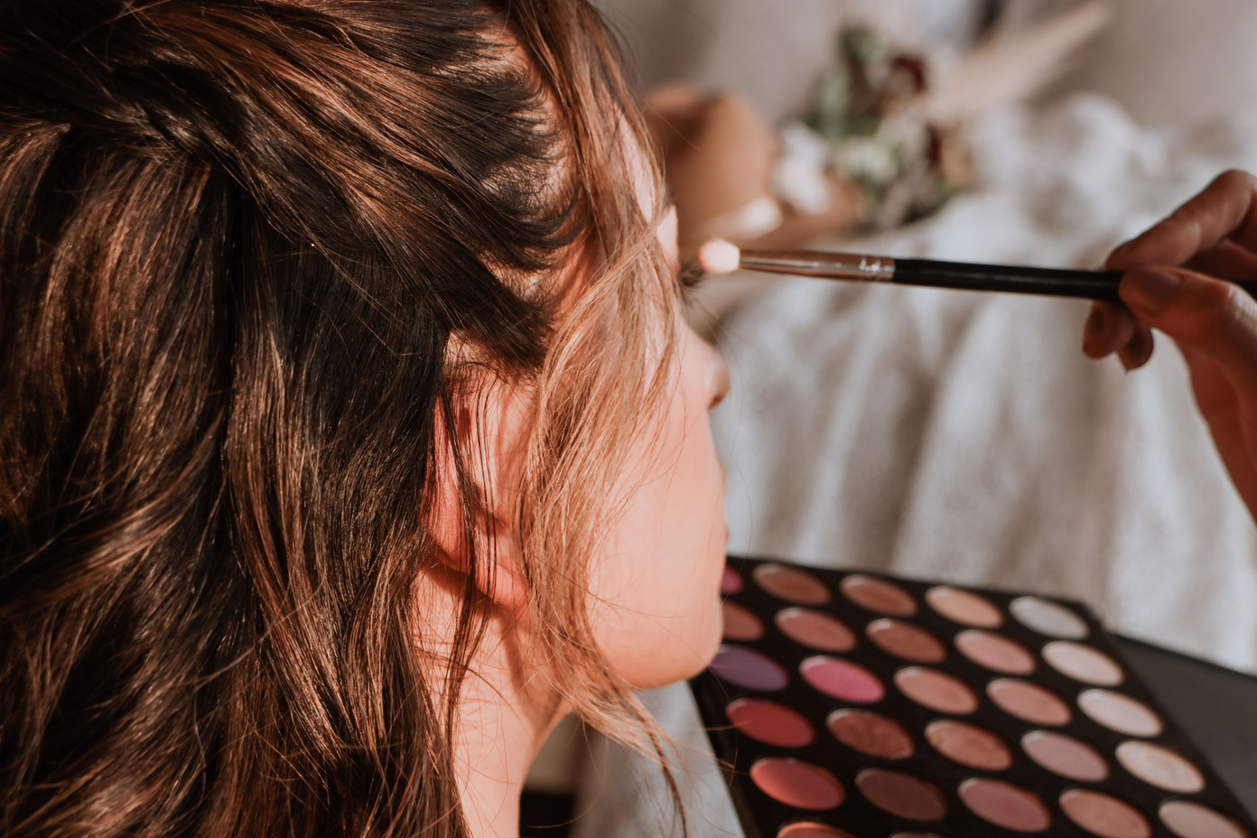 Makeup Artist Applying Makeup on Bride's Face